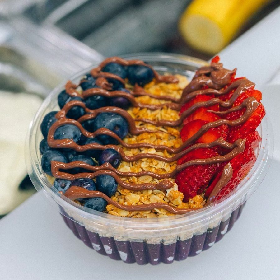 Açaí bowl topped with mango, strawberries, blueberries and granola