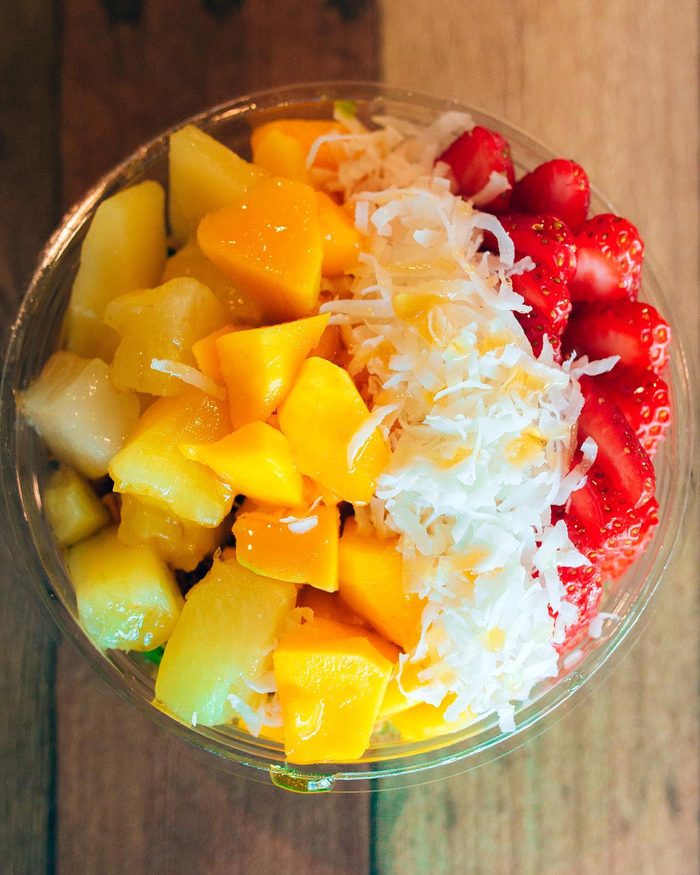 Rainbow açaí bowl with mango, strawberry and coconut